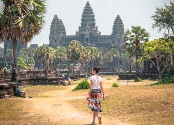 A women traveler in Angkor wat Temple on Cambodia solo vacation